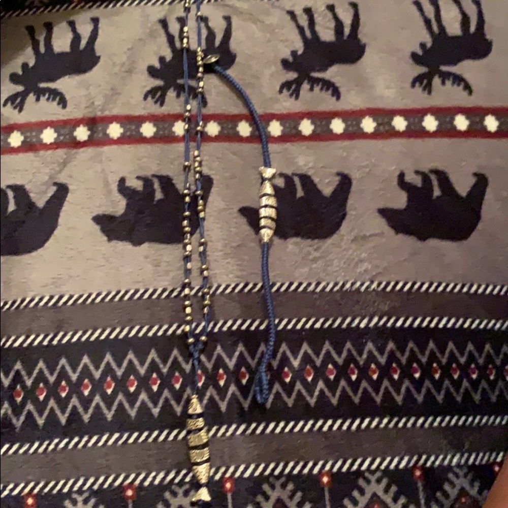 Navy necklace and bracelet set with silver fish.
